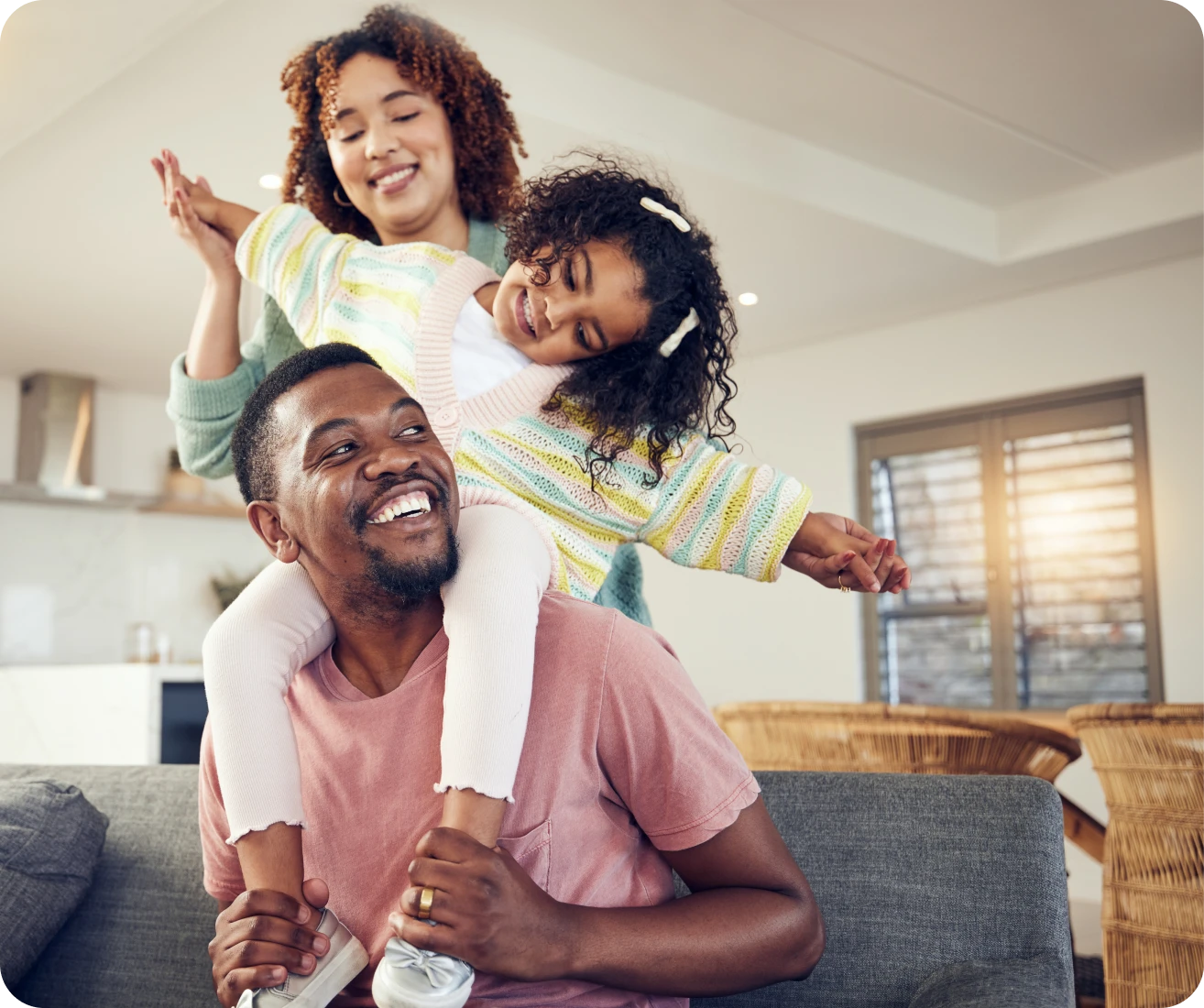 Father giving daughter a piggyback ride