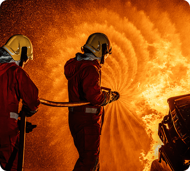 Firefighters in action against swirling flames