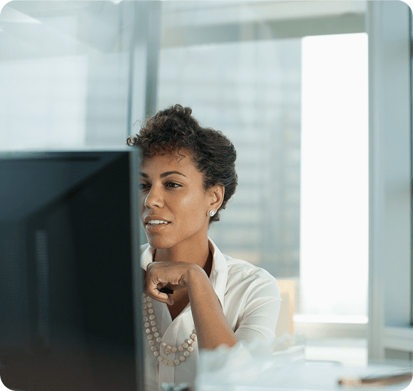 Professional woman focused on screen