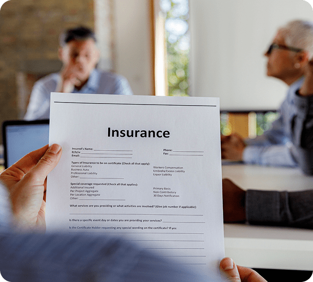 Business meeting discussing insurance papers