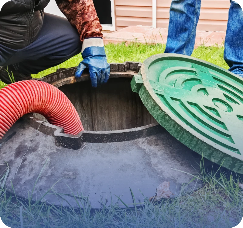 Sewer maintenance with red hose and gloves